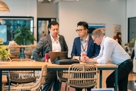 Business team collaborating at a workspace, focused on scaling strategy.