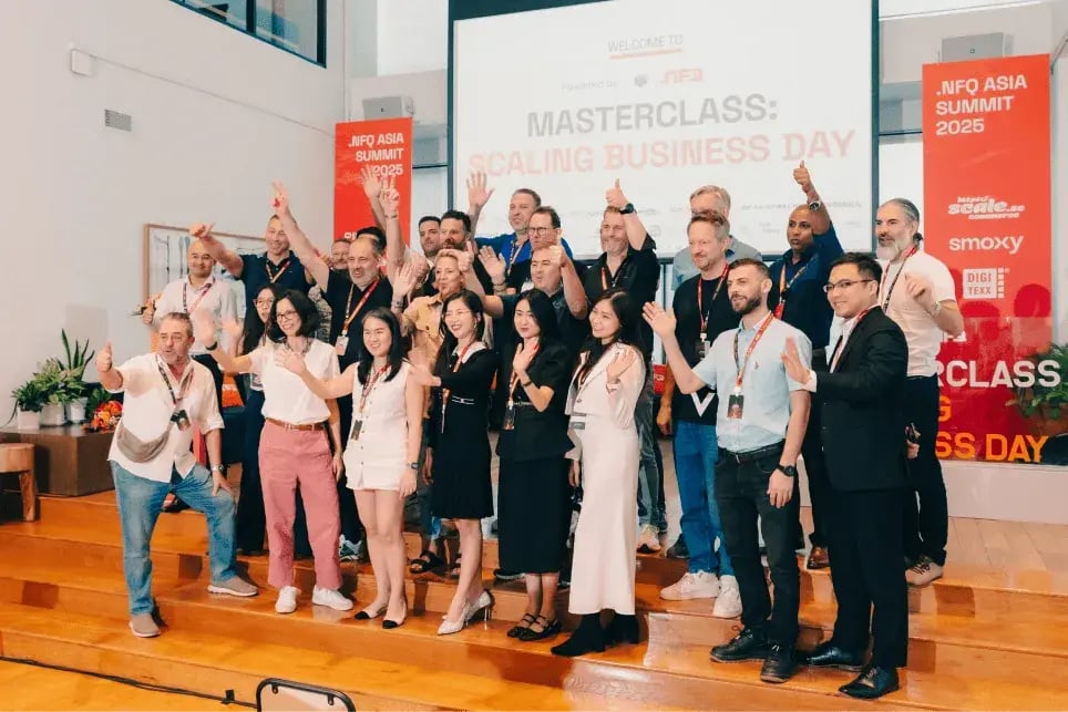 A group of people joyfully posing for a photo at the event. 