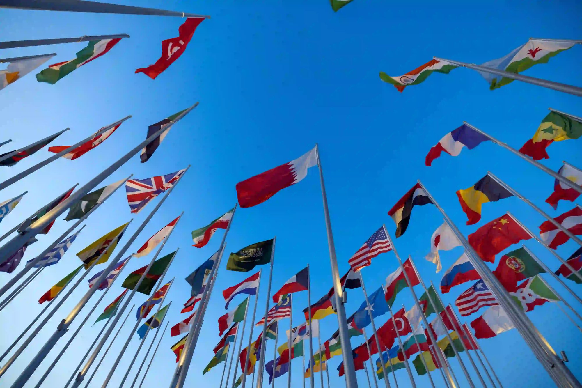 International flags waving against a blue sky. International flags waving against a blue sky.