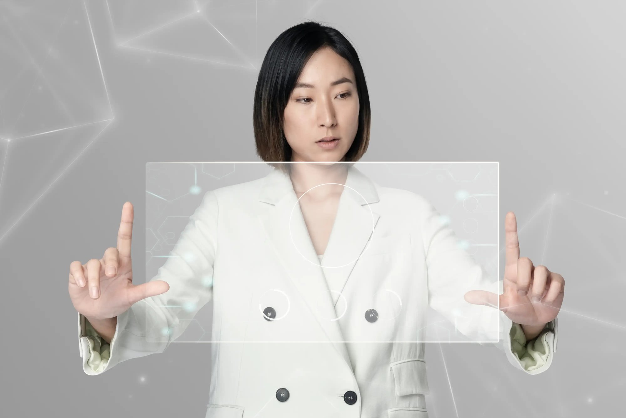 Businesswoman interacting with transparent digital interface.